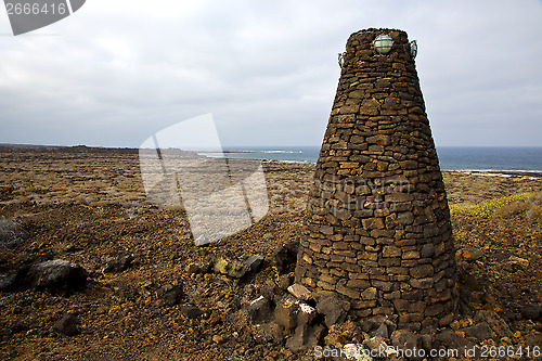 Image of tower spain  hill      black rocks   the   lanzarote 