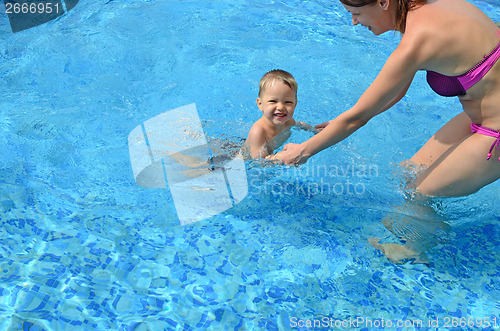 Image of baby with mother