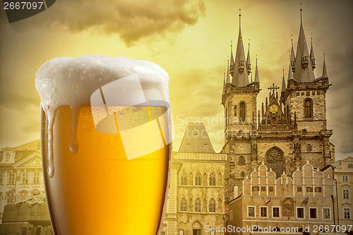 Image of Glass of beer against Tyn Church in Prague