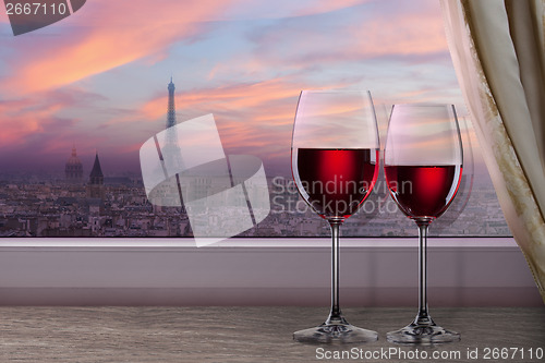 Image of View of Paris and Eiffel tower on sunset from window with two gl