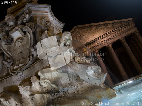 Image of Fountain of Piazza Rotonda at night outside Pantheon in Rome, It