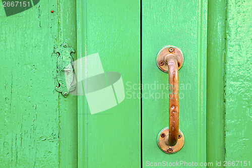 Image of spain   brass knocker  abstract door wood in the green 