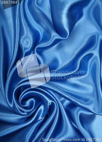 Image of Smooth elegant blue silk as background 