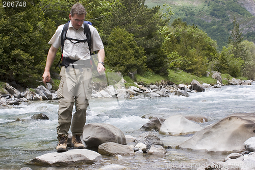 Image of Crossing a river in the mountains