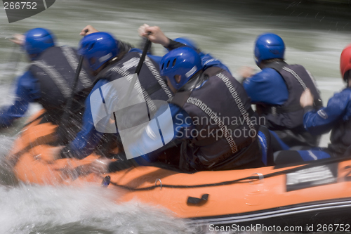 Image of Working together in a rafting boat