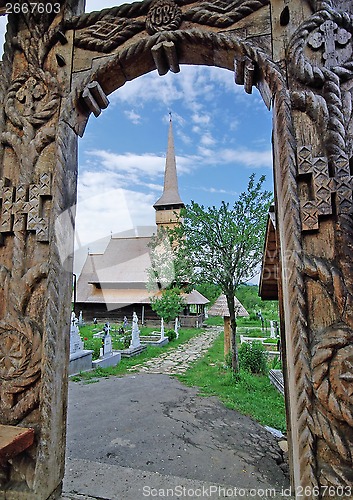 Image of Wood gate and church