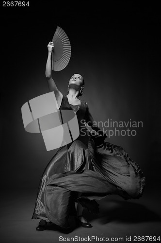 Image of Black and white photo of young woman dancing flamenco