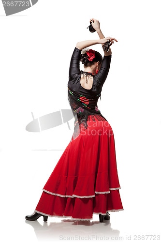 Image of young woman dancing flamenco with castanets isolated on white