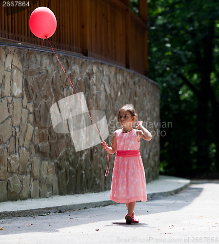 Image of Little girl with balloon