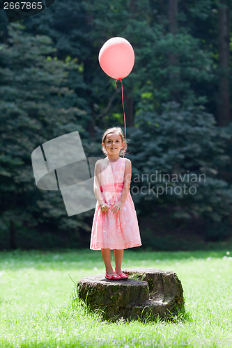 Image of Little girl with balloon