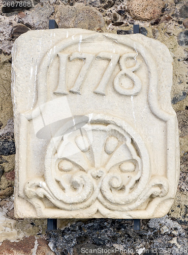 Image of stone slab engraved with the year 1778. In the monastery of Poblet