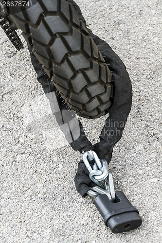 Image of chain and padlock security wheel motorcycle
