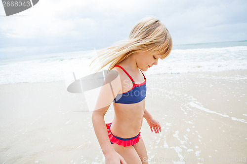 Image of Happy young girl at the beach