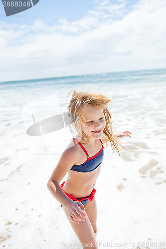 Image of Young girl having fun at beach