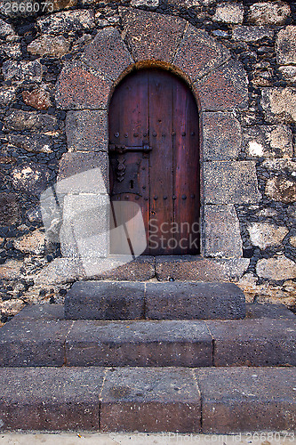 Image of lanzarote  spain canarias brass brown knocker in a   closed wood