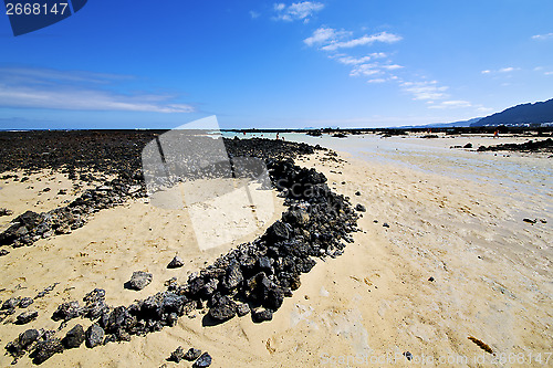 Image of people spain  hill white  beach  spiral of black rocks     lanza