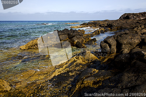 Image of spain  pond  stone sky coastline and summer   lanzarote 