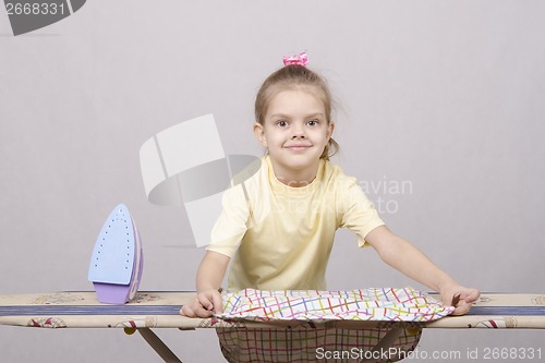 Image of The girl turns underwear when Ironing