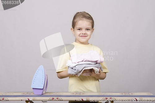 Image of Girl petting things iron