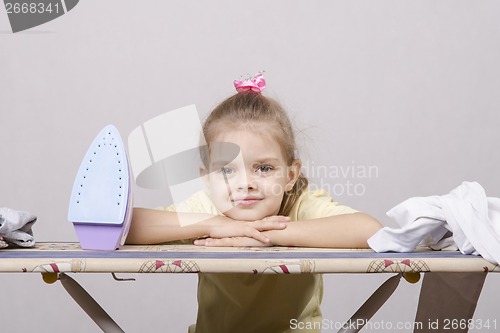 Image of child rests on the Ironing