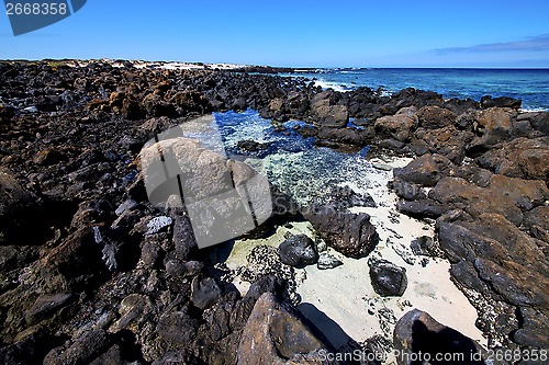 Image of sky light  beach water  in lanzarote  isle foam rock spain lands