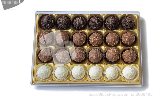 Image of Chocolate sweets in the box on the white background.