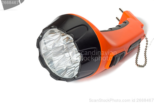 Image of Electric rechargeable led flashlight on a white background.