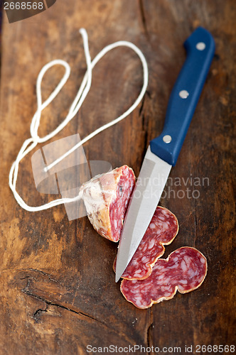 Image of italian salame pressato pressed slicing