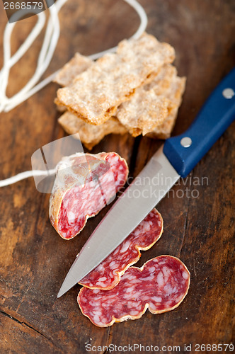 Image of italian salame pressato pressed slicing