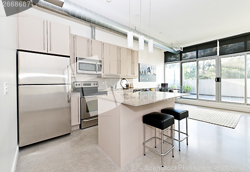 Image of Modern condo kitchen and living room