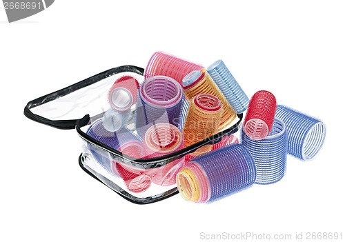 Image of Case of hair rollers on white