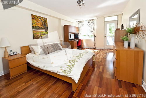 Image of Bedroom interior with hardwood floor