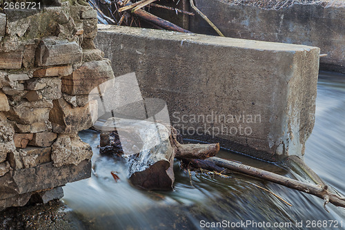 Image of detail of old river dam