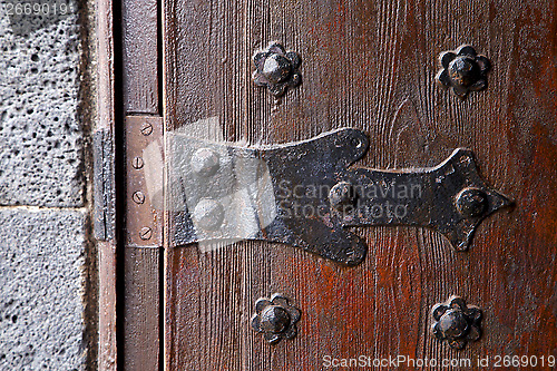 Image of castle lock spain knocker  abstract r wood in the red brown 