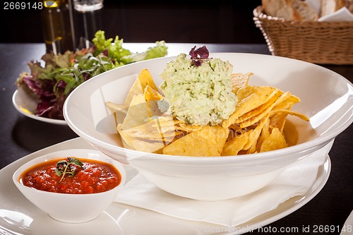 Image of Crisp corn nachos with guacamole sauce