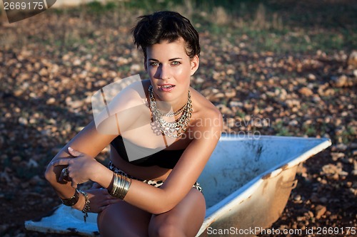 Image of Glamorous woman in animal print shorts