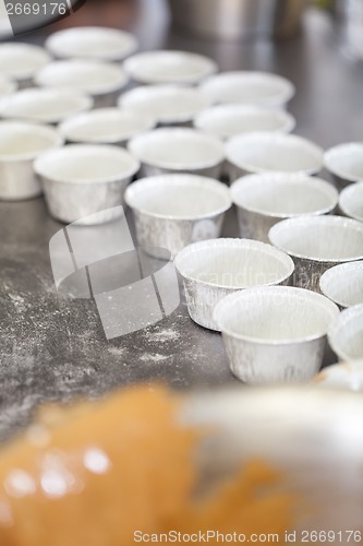 Image of Chef preparing desserts removing them from moulds