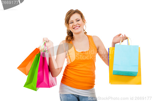 Image of attractive young woman with colorful shopping bags