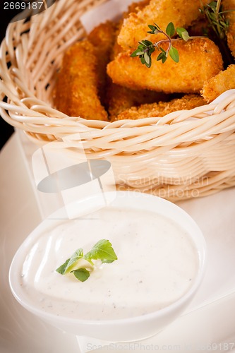 Image of Crumbed chicken nuggets in a basket