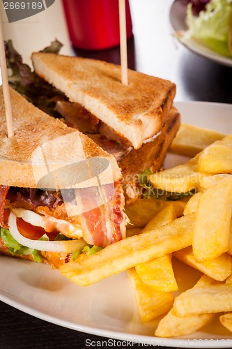 Image of Club sandwich with potato French fries