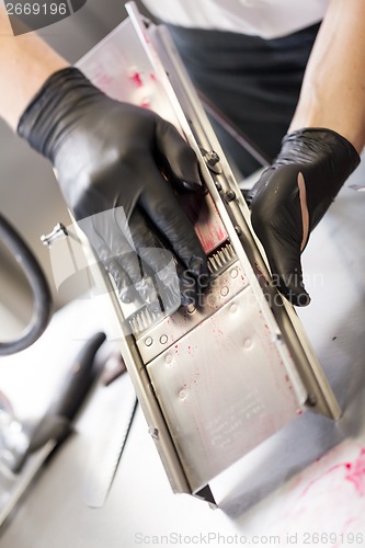Image of Chef slicing boiled beetroot