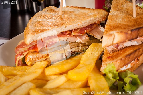 Image of Club sandwich with potato French fries