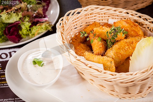 Image of Crumbed chicken nuggets in a basket