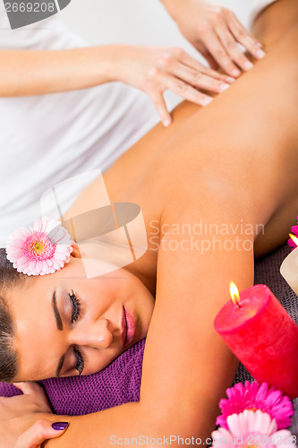 Image of Beautiful woman having a back massage