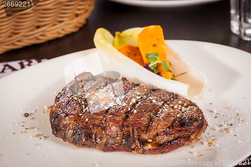 Image of Grilled beef steak with seasoning