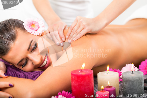 Image of Beautiful woman having a back massage