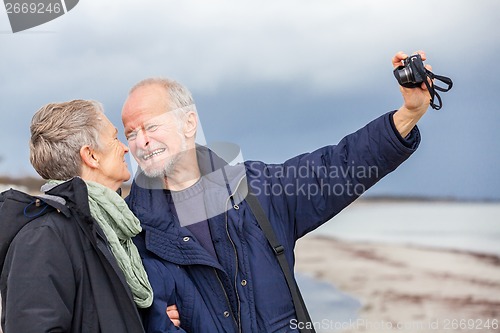 Image of Elderly couple taking a self portrait