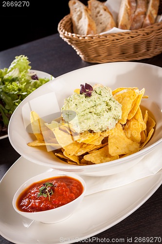 Image of Crisp corn nachos with guacamole sauce