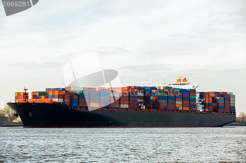 Image of Fully laden container ship in port