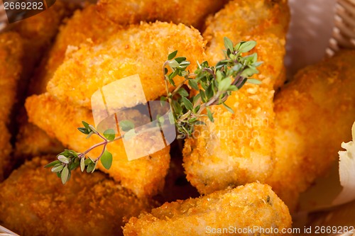 Image of Crumbed chicken nuggets in a basket